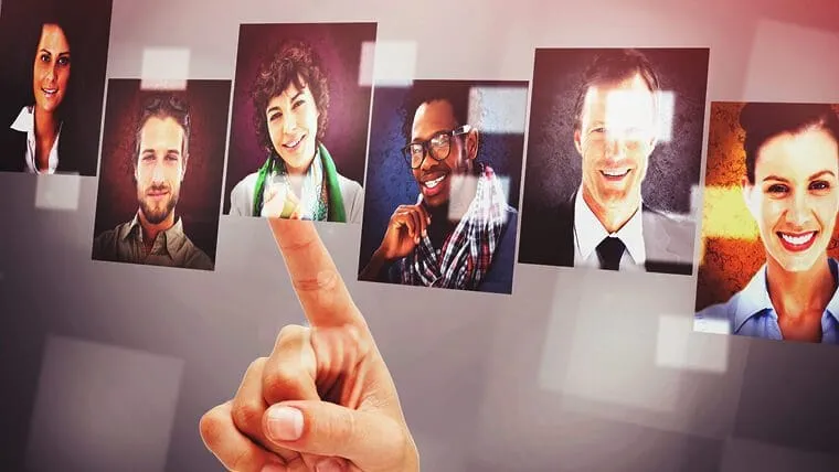 Digital montage showing a finger selecting one of five floating headshots representing diverse individuals in a professional setting.