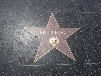 Hollywood Walk of Fame star labeled ‘EDITH HEAD’ on a terrazzo sidewalk.